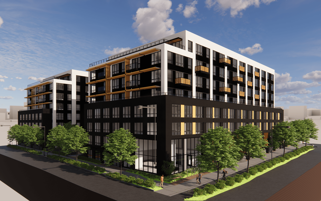 A modern multi-story building with balconies and a black and white exterior.
